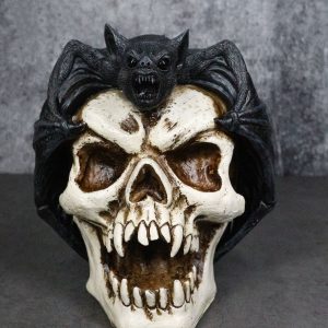 Gothic Nocturnal Vampire Bat Perching On Dracula Fanged Skull Figurine
