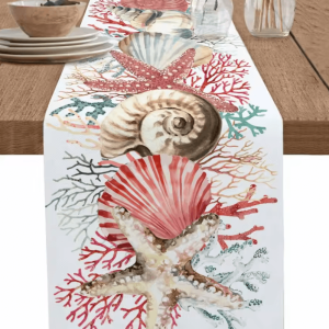 Bring the calm beauty of the seaside into your home with this elegant ocean coral table runner. Designed with delicate c
